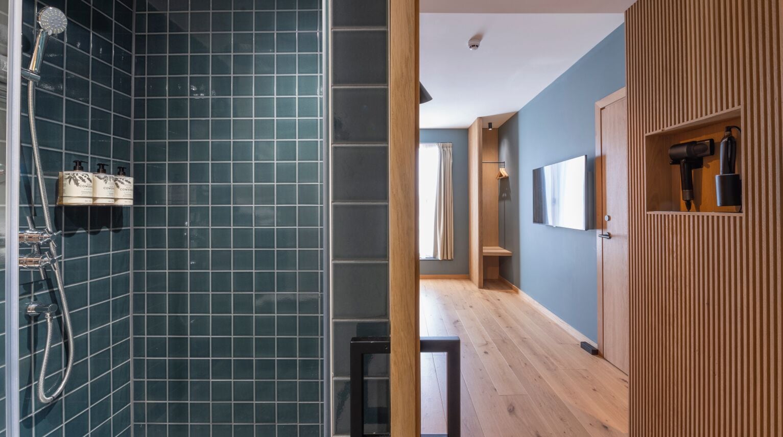 shower, rainfall showerhead, hair dryer, towels