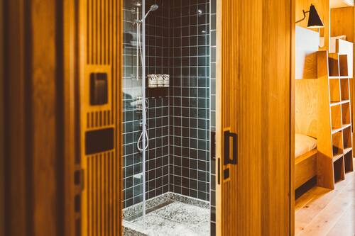 Shower, rainfall showerhead, hair dryer, towels