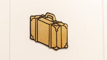 A suitcase with a handle and a textured surface.
