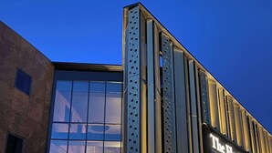 A modern building with a glass facade and a sign reading "The Florian". - The Florian Amsterdam Schiphol Airport, WorldHotels Crafted (Hoofddorp)