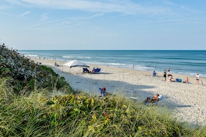 On the beach, sun loungers, beach towels