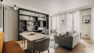 65-inch flat-screen TV with cable channels, fireplace, Netflix