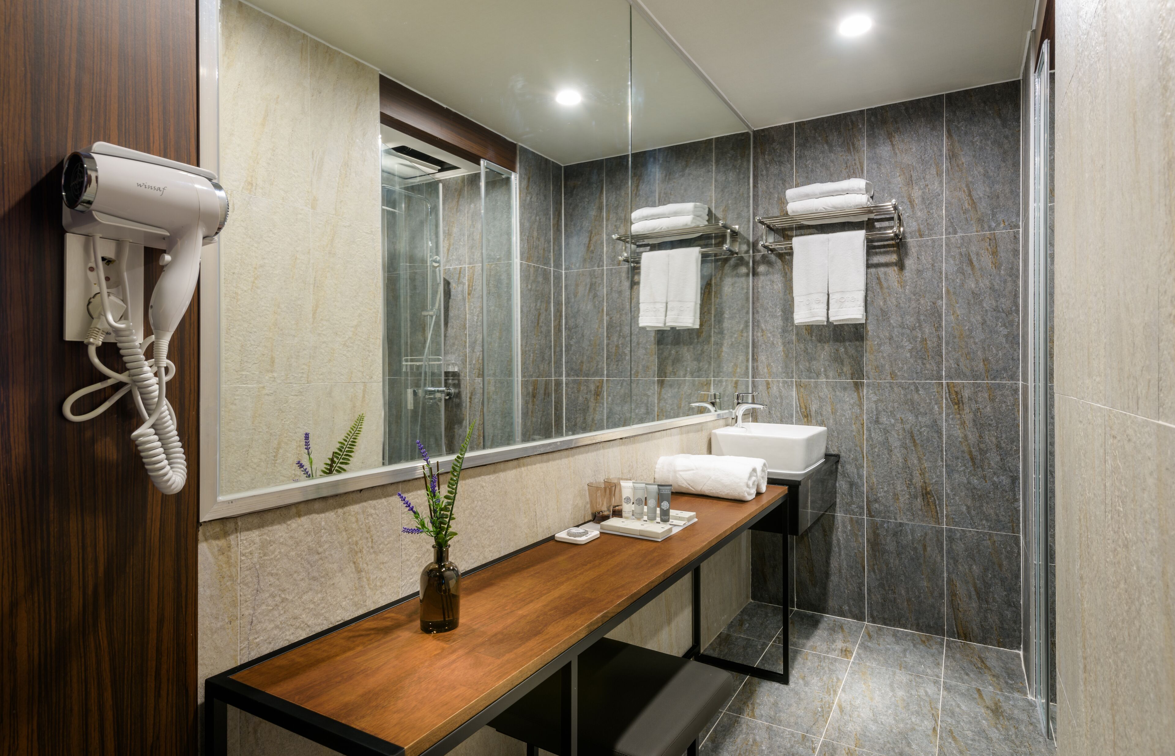 deluxe double room | bathroom | shower, hair dryer, slippers, towels