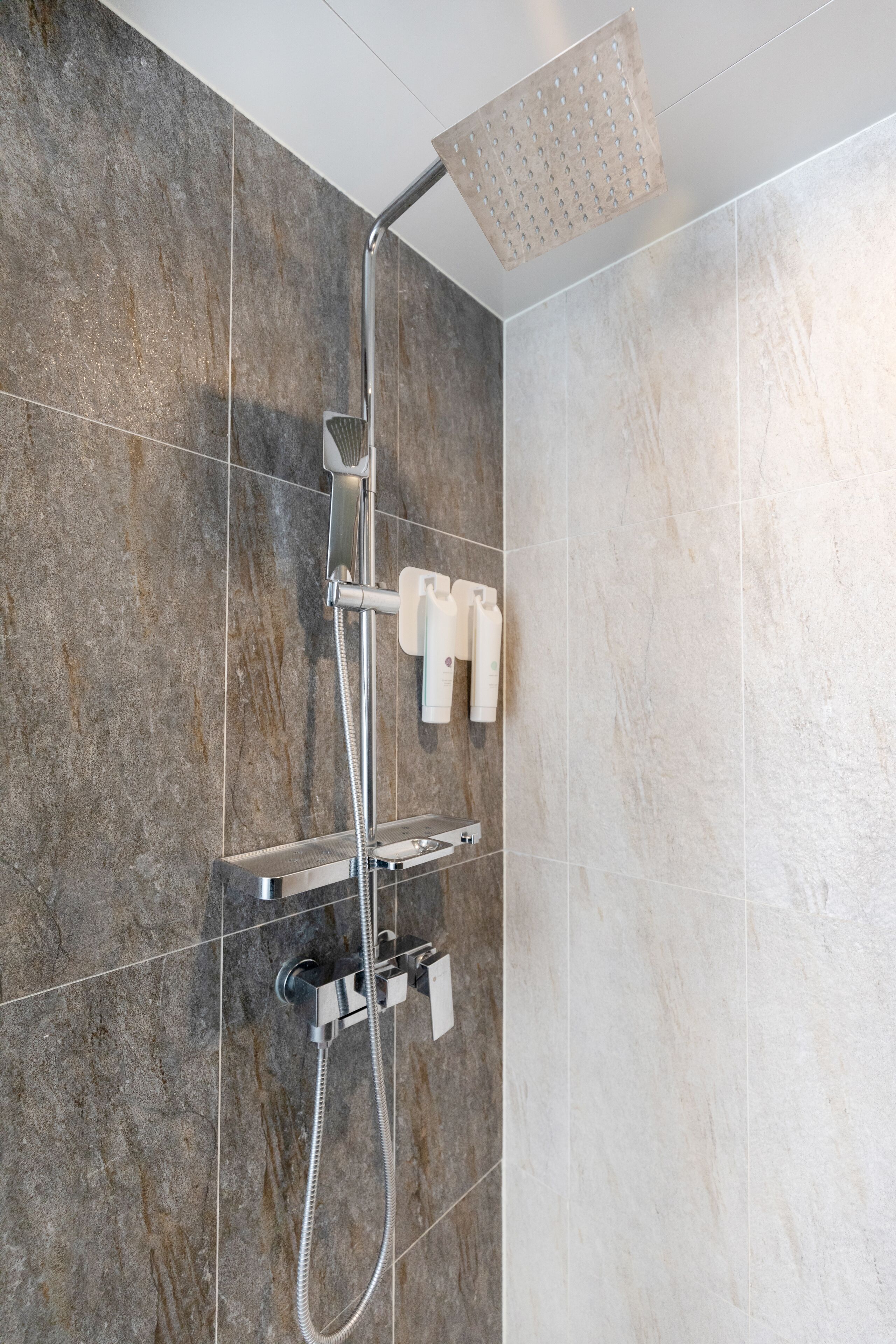 shower, hair dryer, slippers, towels