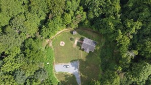 An aerial view of a property surrounded by dense forest. - Serenity and Seclusion in Roan Mountain, TN  (Roan Mountain)