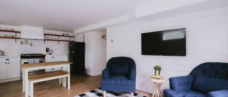 Spacious living room, dining area and fully stocked kitchen.