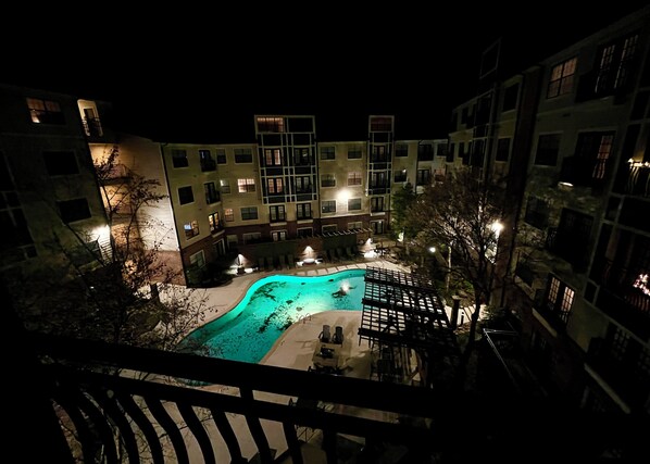 Guests can enjoy a refreshing swim in the hotel's outdoor pool surrounded by a deck with seating.