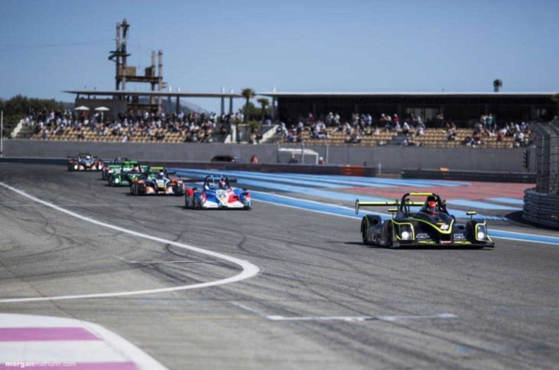 A racing track with multiple cars.