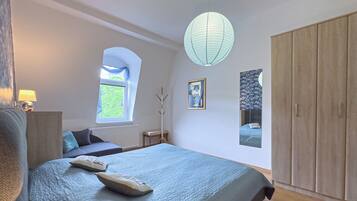 1 bedroom, desk, iron/ironing board, travel crib