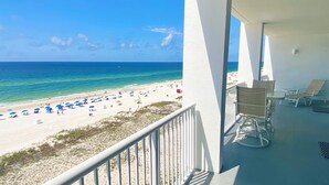 A balcony with a view of a beach and ocean. - Serenity: Island Tower 702 3BR 3BA, 2 Gulf-Front Masters, + Free Beach Service!! (Gulf Shores)
