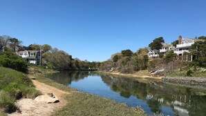 A river with a dirt path and houses on both sides. - South Chatham cottage walk to beaches, dining, tennis, shops, bike path.  (Chatham)