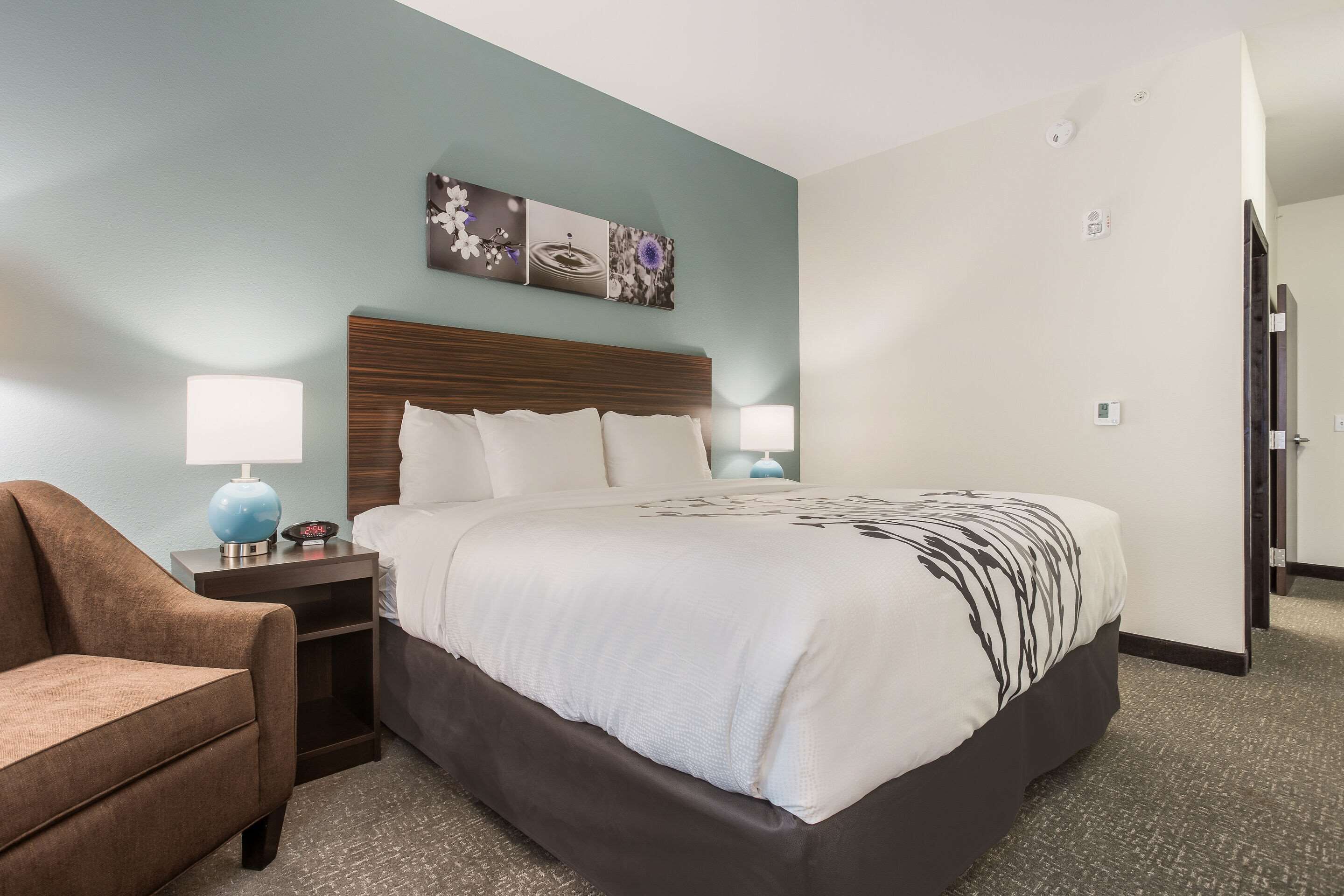 pillow-top beds, desk, laptop workspace, blackout curtains