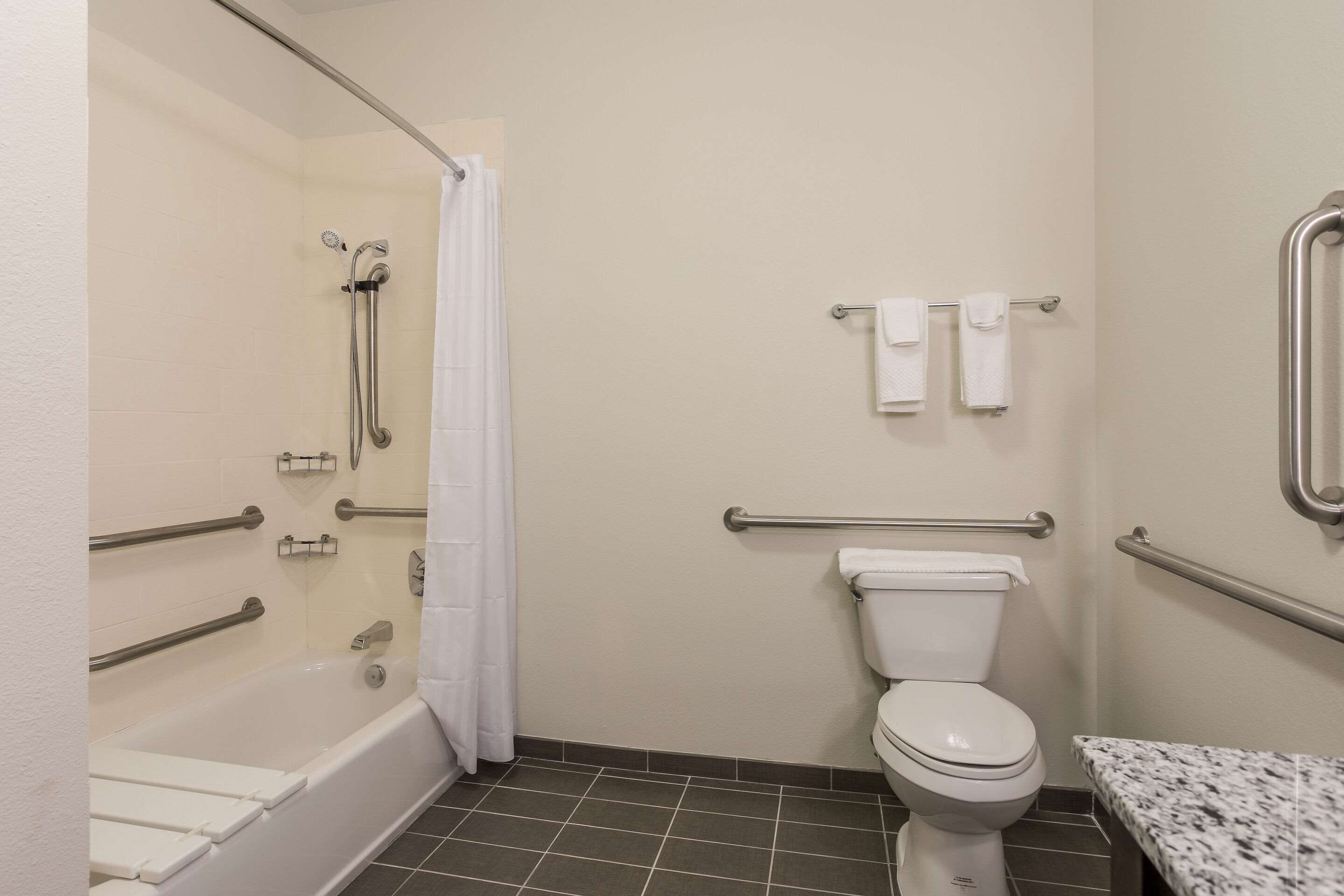 pillow-top beds, desk, laptop workspace, blackout curtains