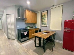 Enjoy cooking in this well-equipped kitchen with a central island and dining table.