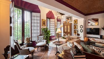 Luxury House | Living area | 50-inch flat-screen TV with cable channels, TV, fireplace