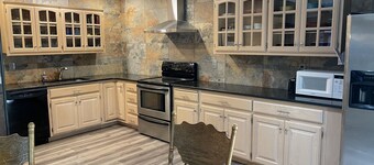 Lake of the Ozarks, “Vista Cove” Private Lake Front Home w/ 2 slip private dock