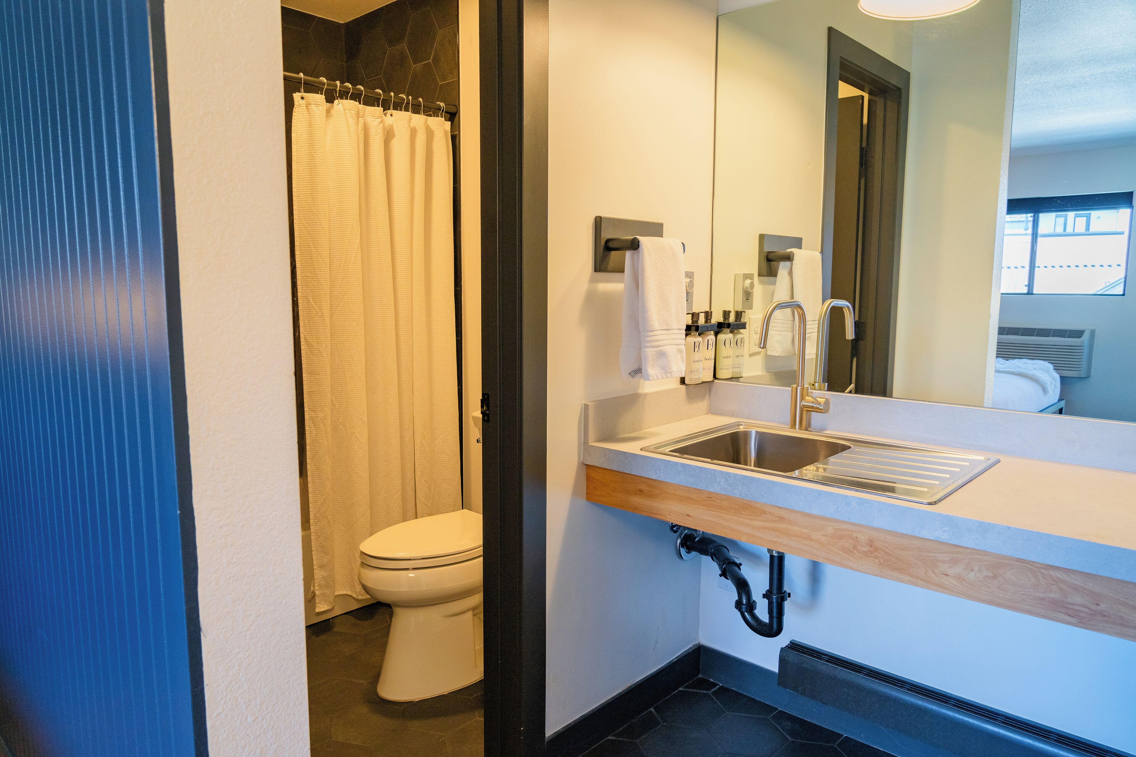 eco-friendly toiletries, hair dryer, bathrobes, slippers