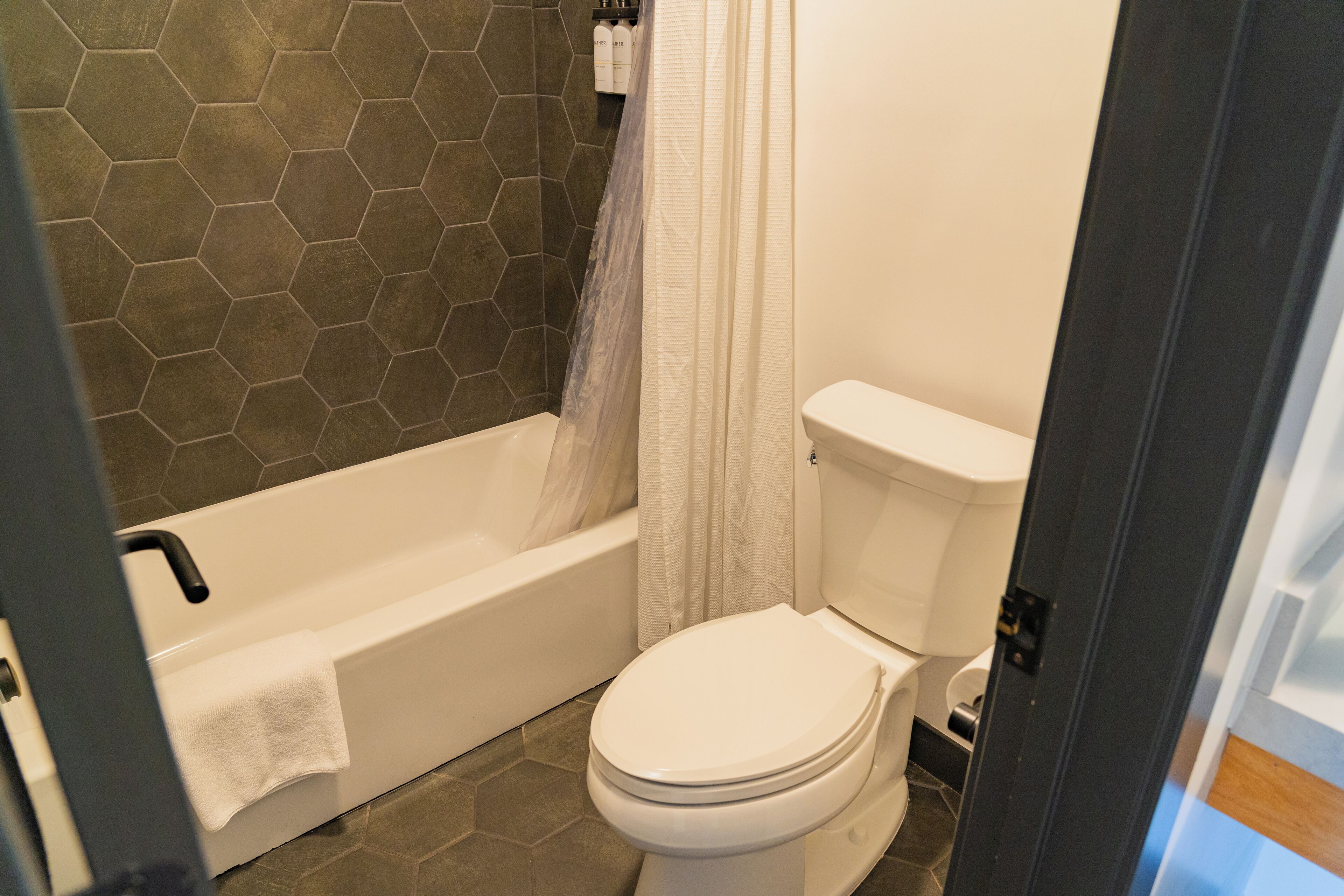 eco-friendly toiletries, hair dryer, bathrobes, slippers