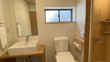 Shower, free toiletries, hair dryer, slippers