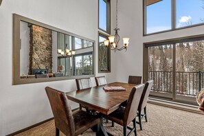 The beautiful wooden table and comfortable chairs invite long, leisurely meals.