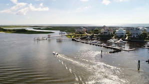 A marina with boats, a pier, and houses in the background. - Spacious Townhome w/Ocean Views, Elevator, Dog Friendly & Steps to Beach (Kure Beach)