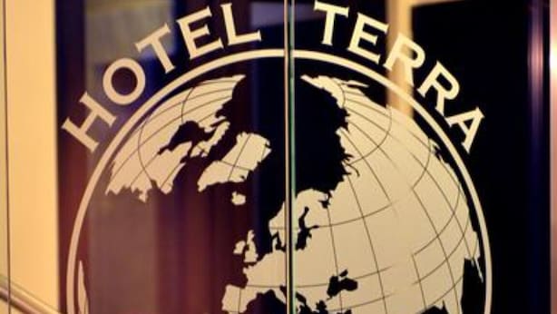 A glass door with a globe logo and the text "HOTEL TERRA" on it. - Hotel Terra (Novalja)