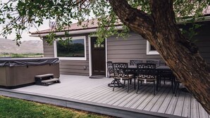 A deck with outdoor furniture, a barbecue, and a view of the mountains. - Salmon Gathering Place sleeps 35 + perfect for reunions.retreats.events (Salmon)