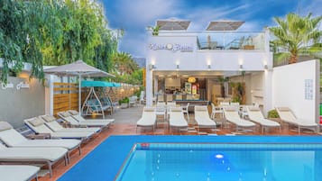 Seasonal outdoor pool, open 9:00 AM to 8:00 PM, pool umbrellas