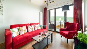 Apartment (18 F) | Living room | Flat-screen TV - Apartamenty Sun & Snow Karpatia (Karpacz)