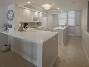 Fridge, microwave, oven, stovetop - Beachfront 2BR/2BA condo on Marco Island with pool and WiFi. (Marco Island)