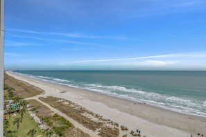Enjoy the serene beach views and gentle waves along the coastline.