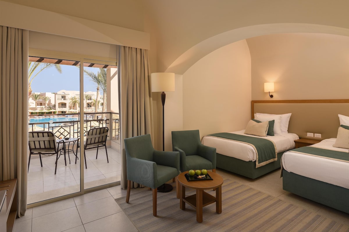 Superior Room, Pool View (Queen or Twin) | 1 bedroom, minibar, in-room safe, free cribs/infant beds