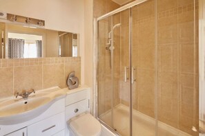 Bathtub, hair dryer, towels, soap