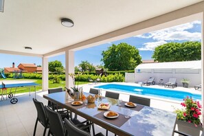 Outdoor dining - Modernly designed villa with private pool can accommodate up to 8 persons. (Barban)