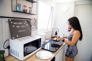 Fridge, microwave, stovetop, coffee/tea maker