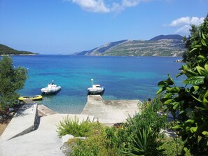 Enjoy serene ocean views and tranquil boat access from this picturesque jetty.