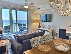 Relax in style with a comfortable sofa set and ocean views from the balcony.