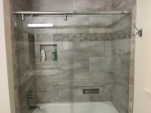 Combined shower/tub, hair dryer, towels, soap