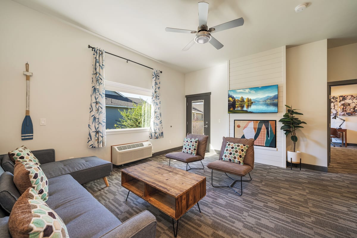 Family Suite, 1 King Bed | Living area | 55-inch Smart TV with cable channels, TV, Netflix