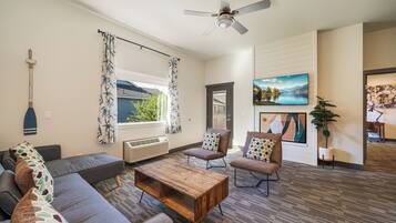 Family Suite, 1 King Bed | Living area | 55-inch Smart TV with cable channels, TV, Netflix