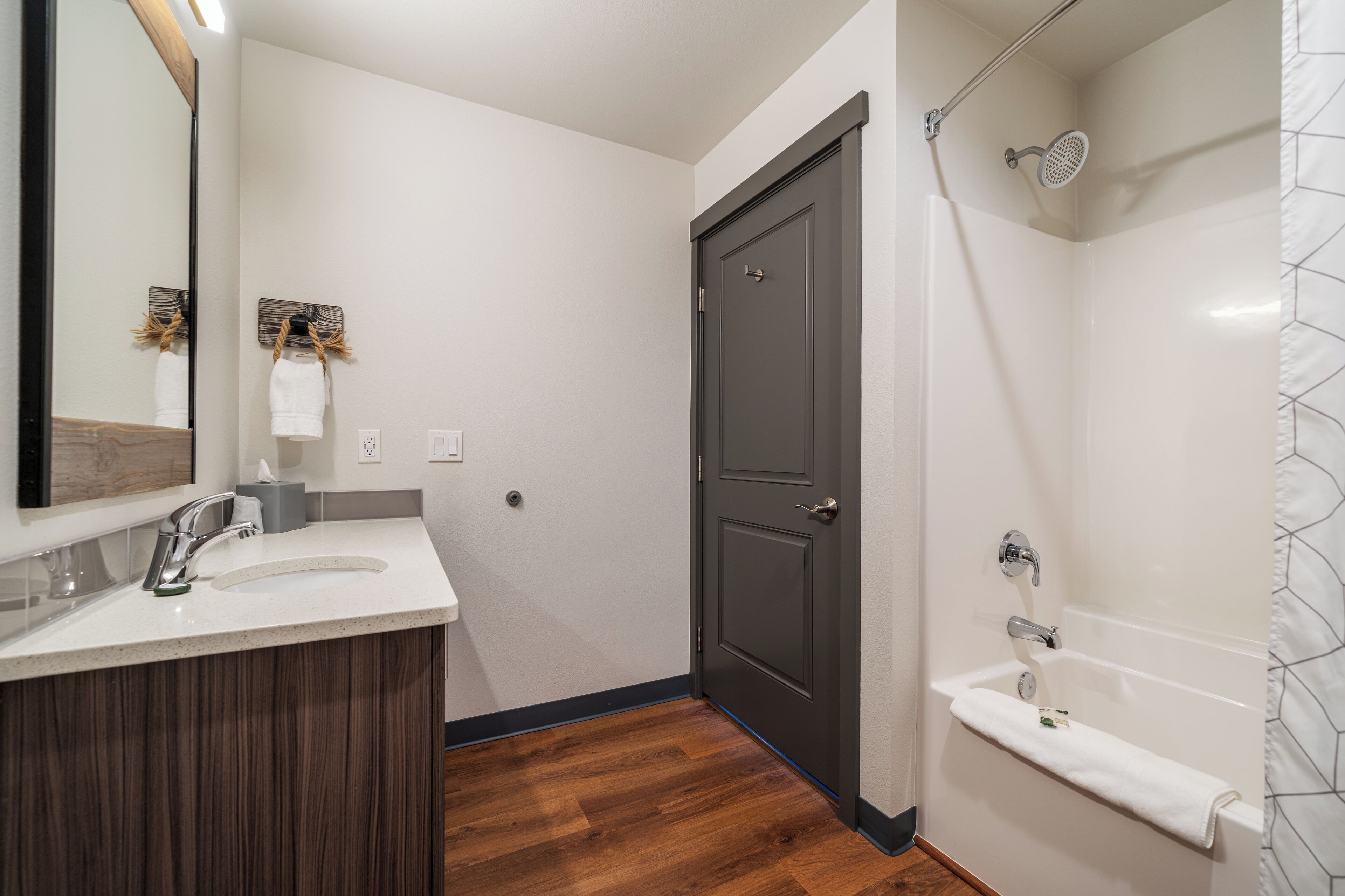 combined shower/bathtub, rainfall showerhead, hair dryer, towels