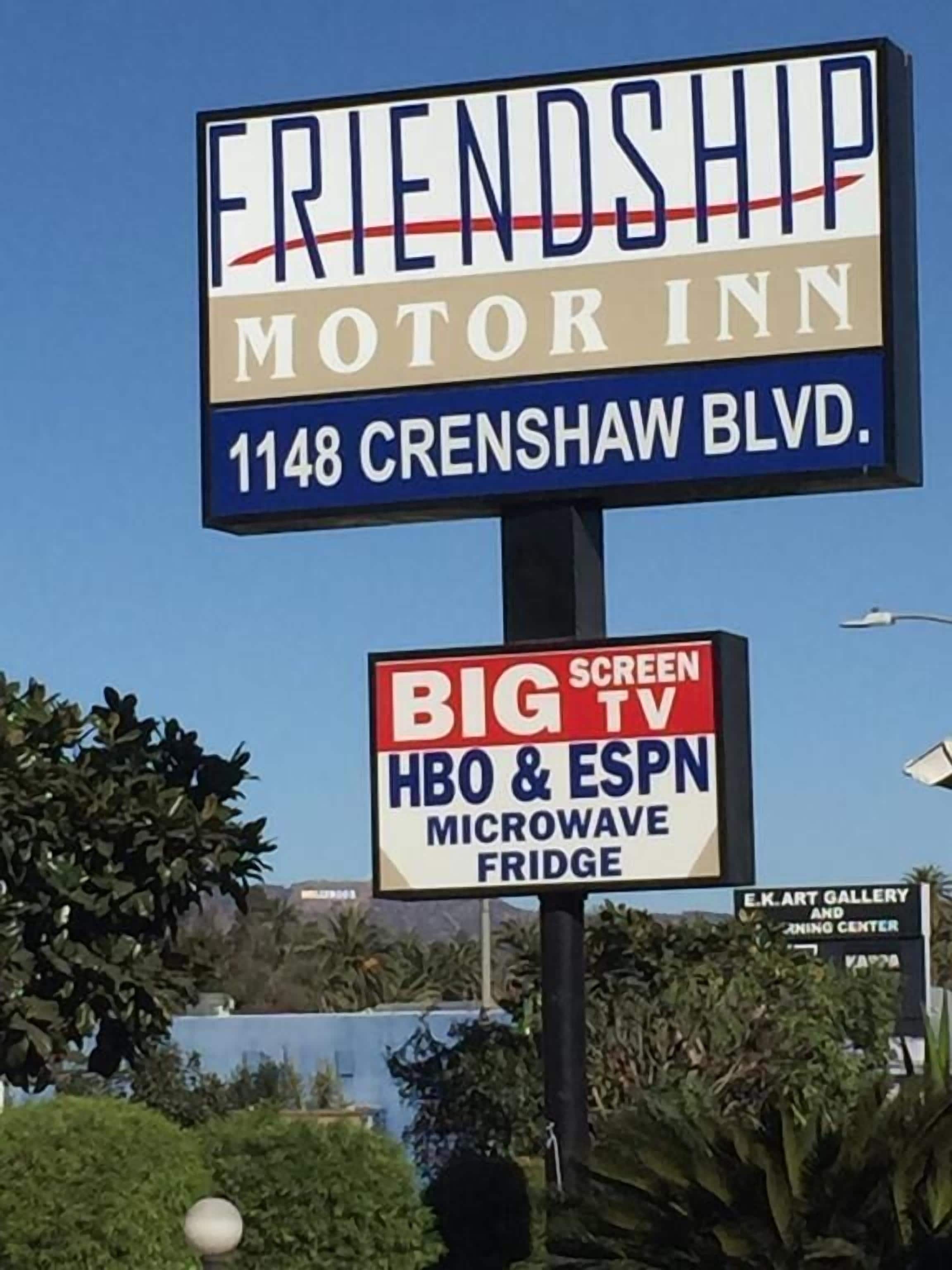 A sign for Friendship Motor Inn at 1148 Crenshaw Blvd. with amenities including Big Screen TV, HBO & ESPN, microwave, and a fridge.