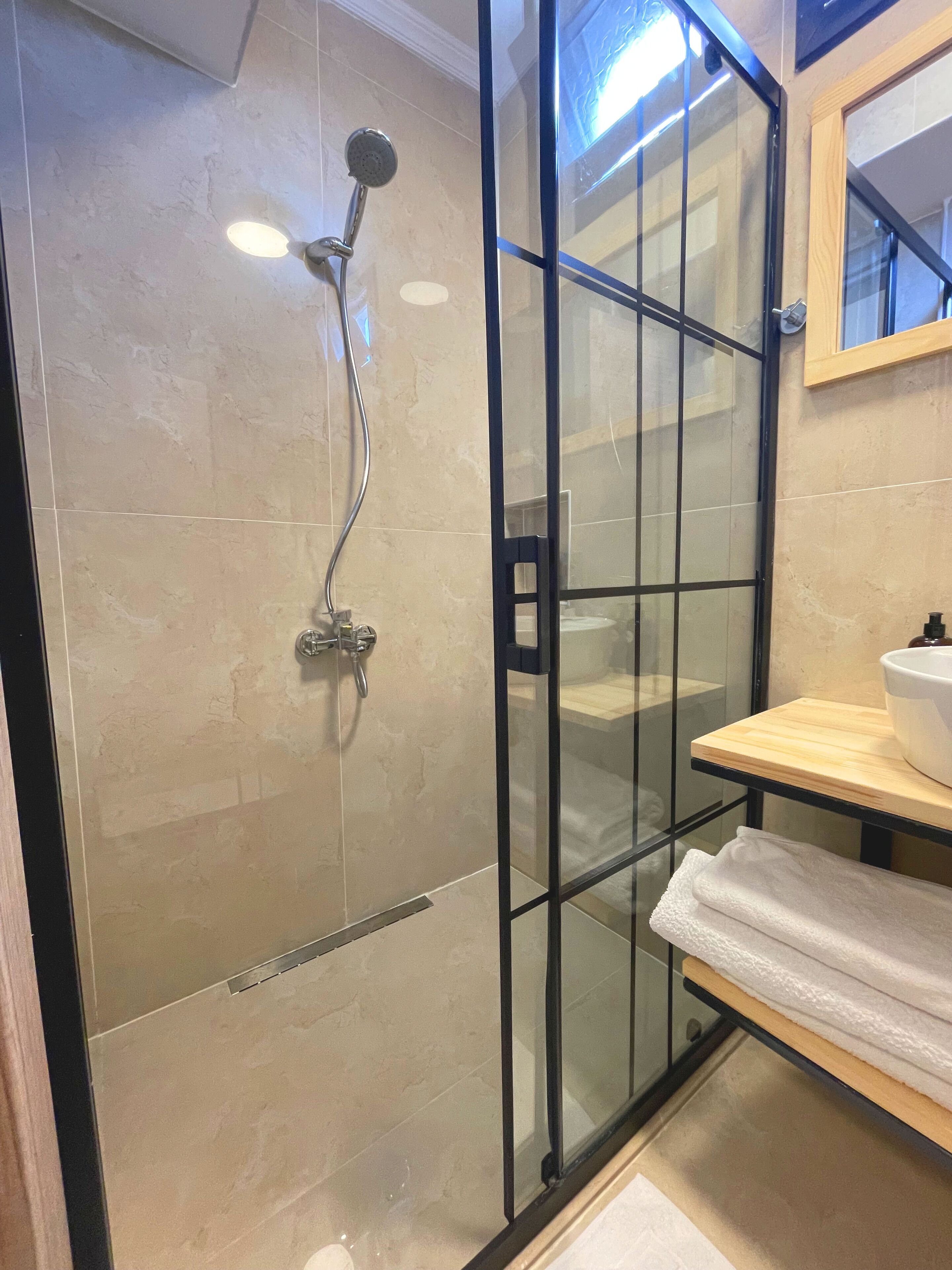 standard quadruple room | bathroom | eco-friendly toiletries, hair dryer, slippers, towels