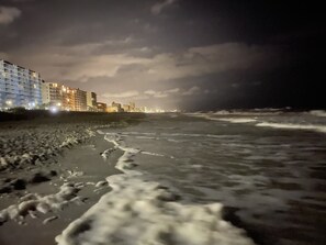 A beach with waves and a city skyline in the background. - Oceanfront Waterpointe1 505-3b/2b-Sleeps 7-Balcony-WIFI-TV-Pool-Family Friendly (North Myrtle Beach)