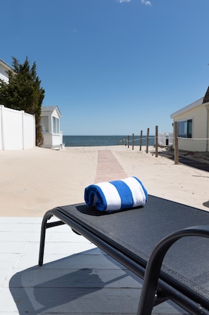 On the beach, sun-loungers