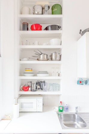 Fridge, oven, coffee/tea maker, dining tables