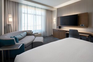 Desk, laptop workspace, iron/ironing board, free cribs/infant beds