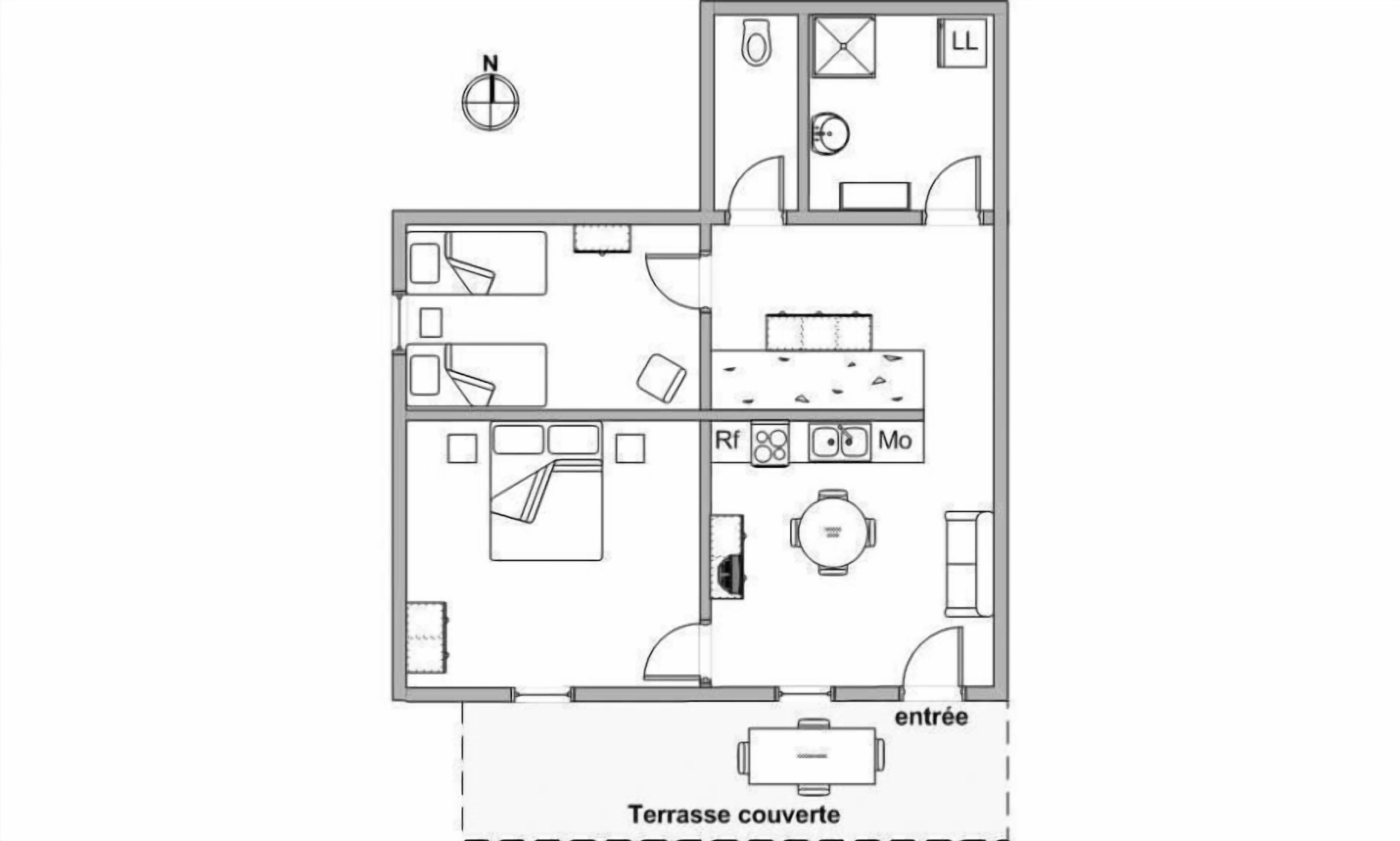 Un plan d’étage d’une chambre d’hôtel comprenant une terrasse couverte, une salle de bain, un coin cuisine et un espace de vie.