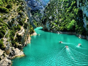 Overlooking a tranquil turquoise bay, this property offers stunning views of the surrounding lush landscape and access to the water for recreational activities.