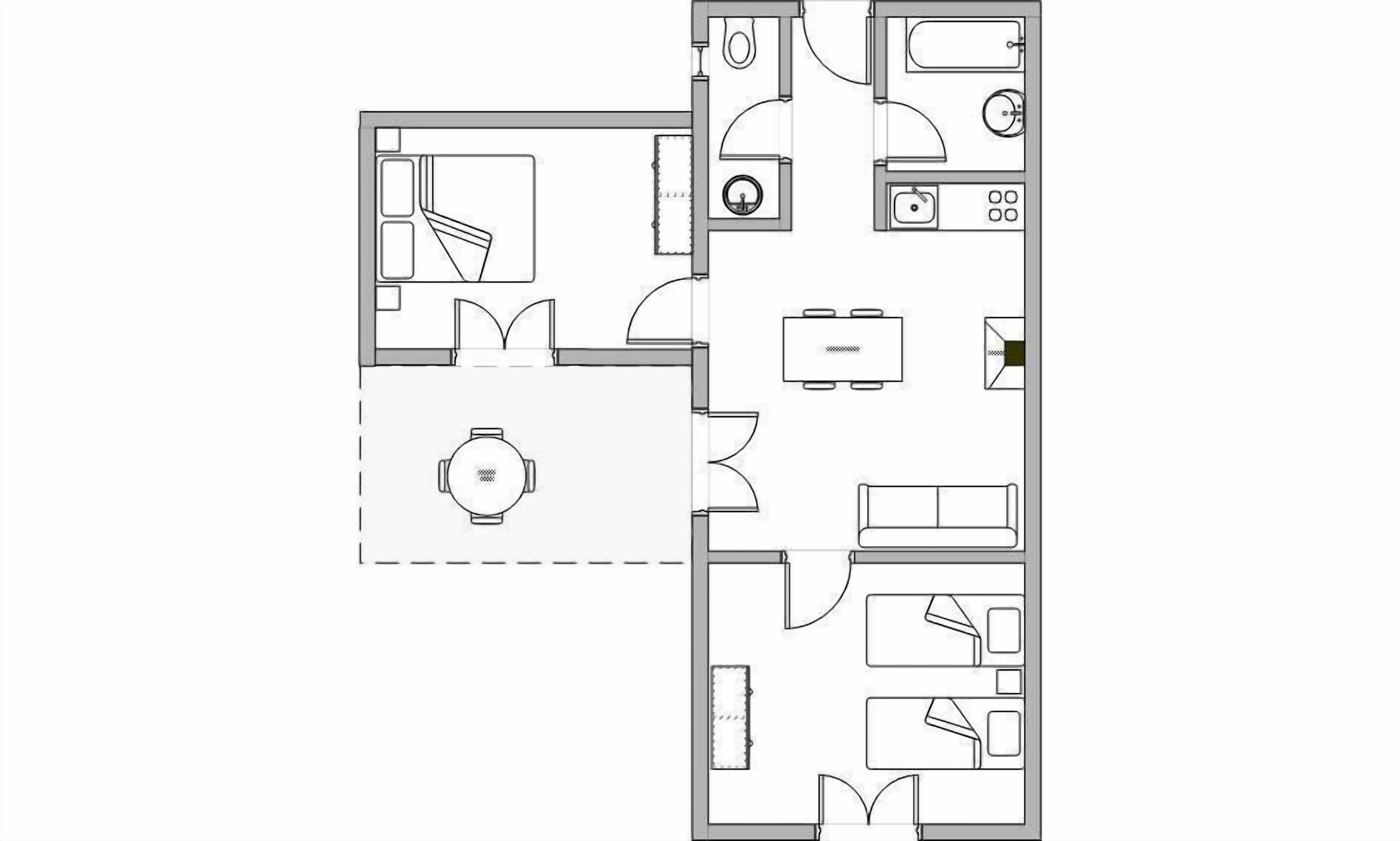 Een plattegrond van een hotelkamer met een bed, een bureau, een stoel, een kleine badkamer en een kitchenette.